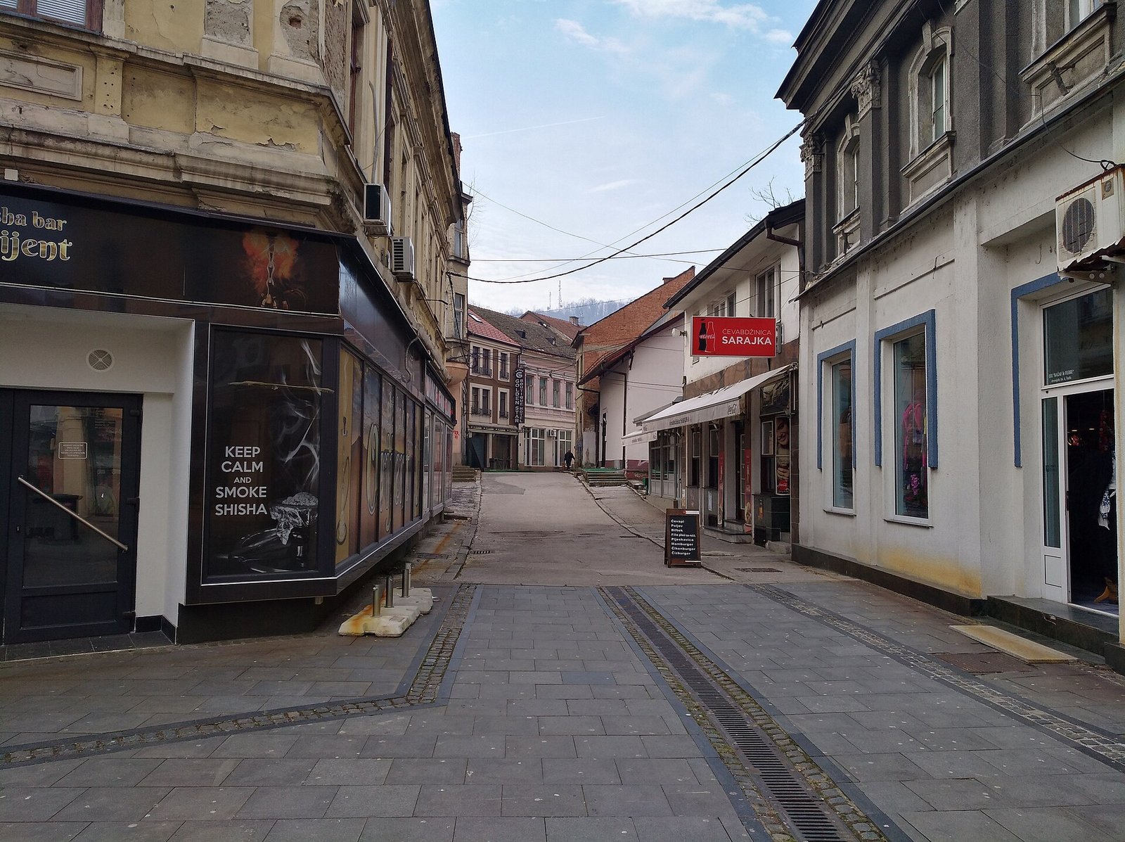 Jevrejska, a narrow paved street in the old town lined with shops and cafés